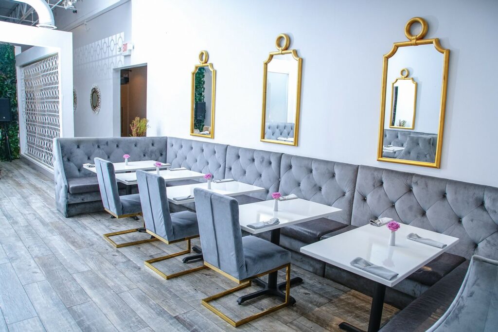 Interior of grey themed restaurant with mirrors on the wall at Baltimore Crab & Seafood