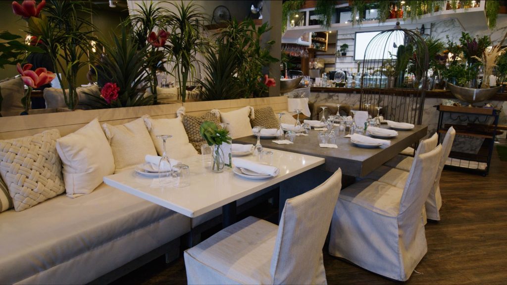 Flowers and white furniture at Garden Parc Brunch & Events