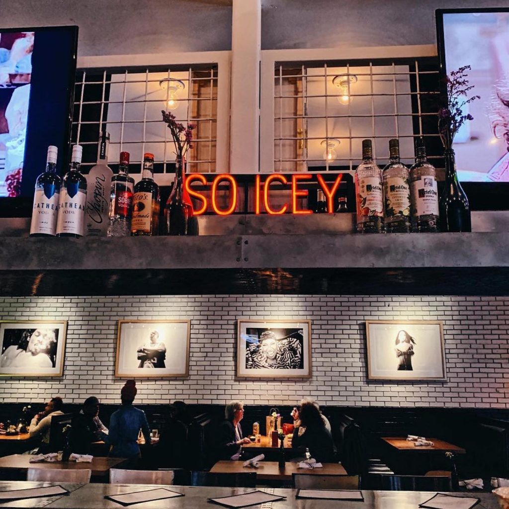 Diners at an ice- themed restaurant painted blue and light grey at Ms. Icey's